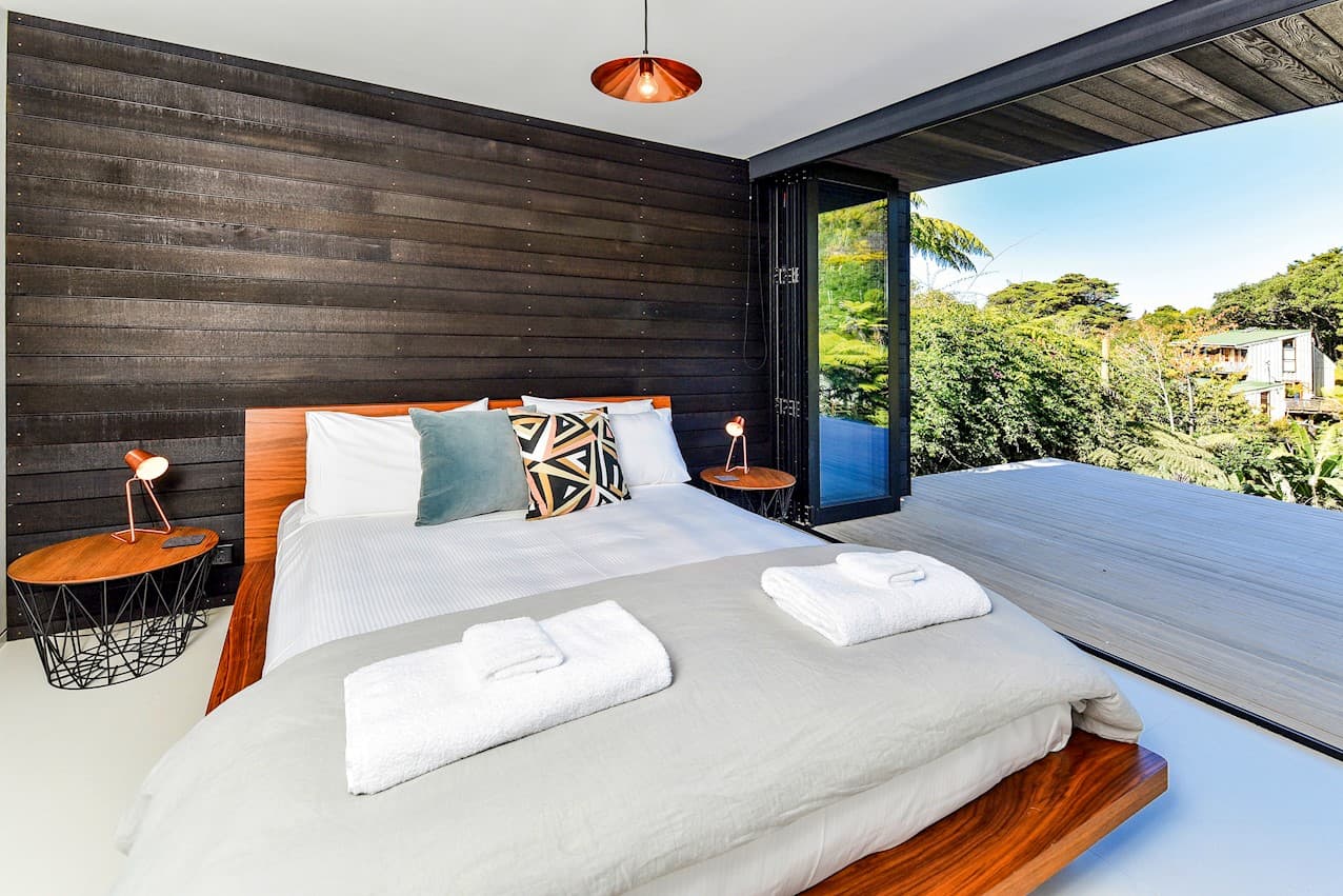 The bedroom, doors folded back