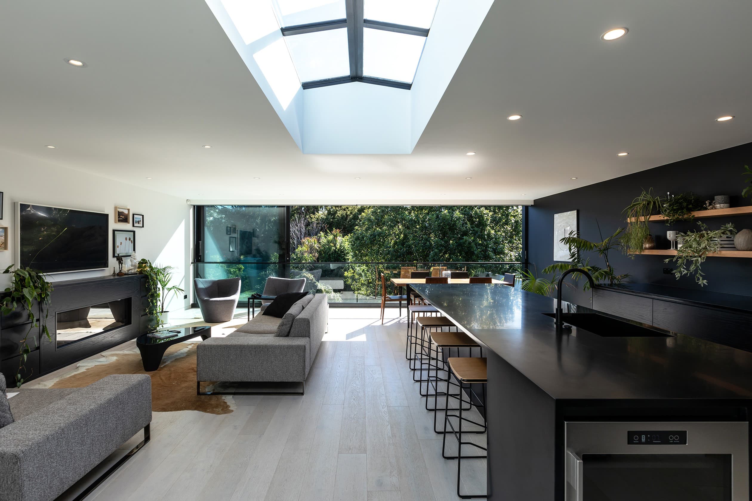 The reworked rear of the Grey Lynn villa, open-plan living under a skylight