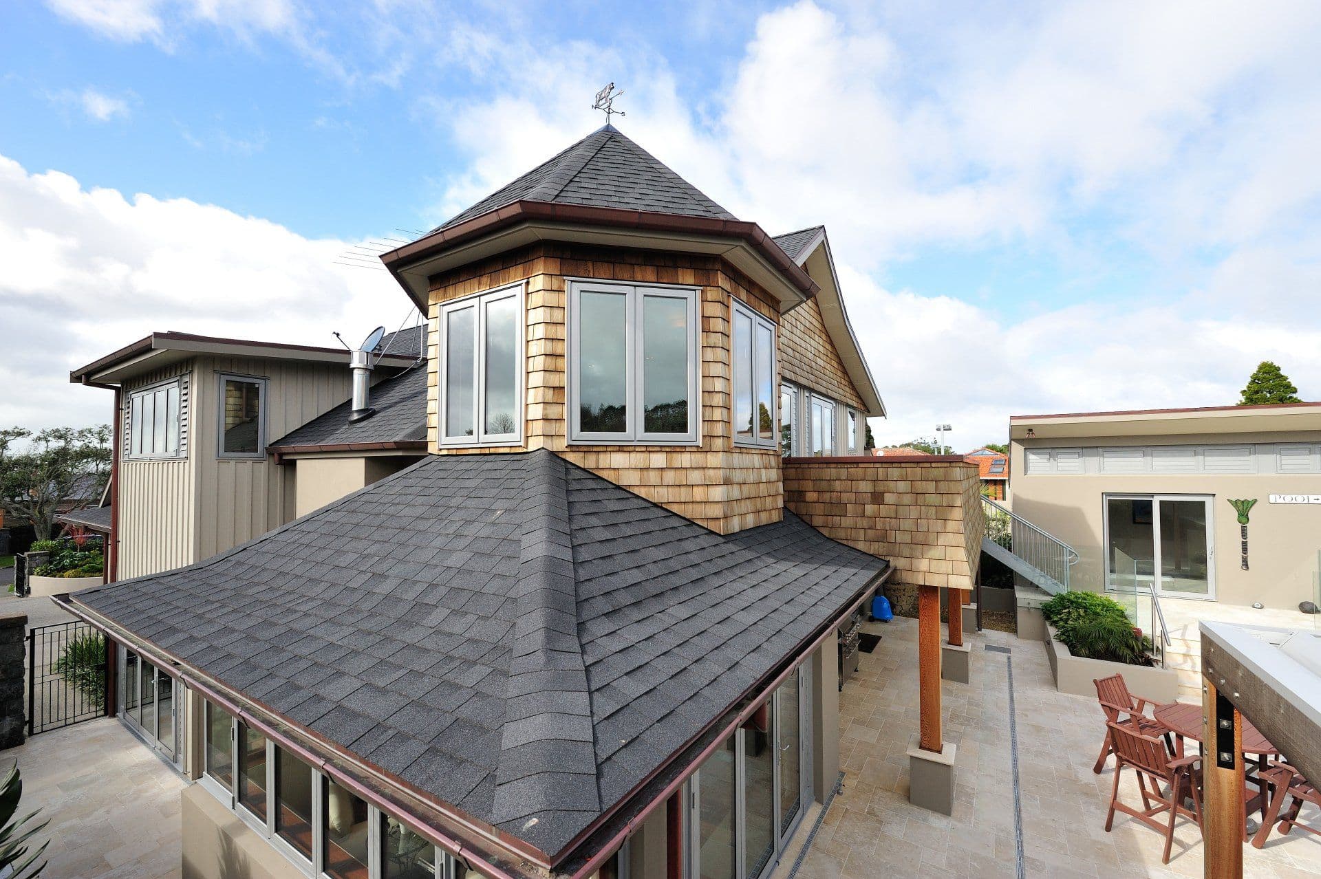 The shingled turret over the entry